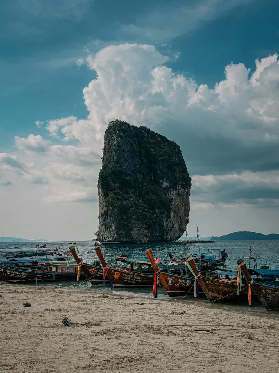 Longtail boats in Krabi with limestone karst scenery